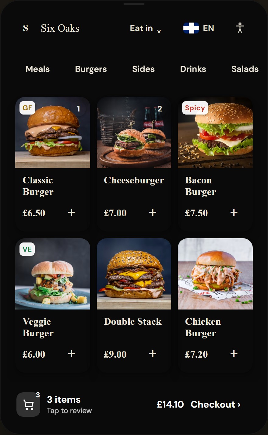 Kiosk browse screen showing category chips, a grid of product cards with photos above solid caption panels, dietary badges, and an order bar with checkout total