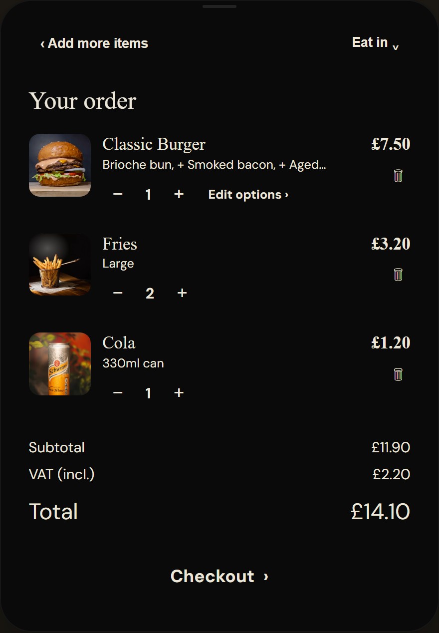 Kiosk review screen listing items with thumbnails, quantity steppers, edit options links, then subtotal, included VAT and total above a checkout button